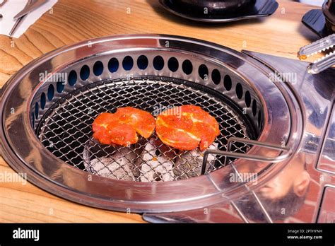 Korean Beef Barbecue On Hot Coals Grill Meat Pork Korean BBQ Traditional Style On Stove Serve
