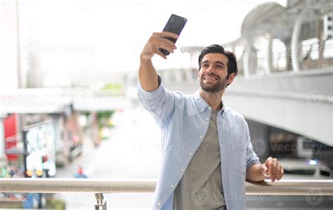 The Young Man Selfie With Himself By The Using Smartphone For Take