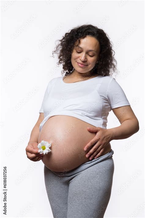 Charming Smiling Happy Latina Gravid Mother Caressing Her Big Pregnant Belly In Late Pregnancy