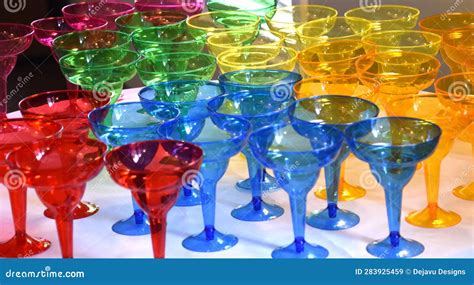 Collection Of Brightly Colored Drinking Glasses On A Table Stock Image Image Of Drink Color