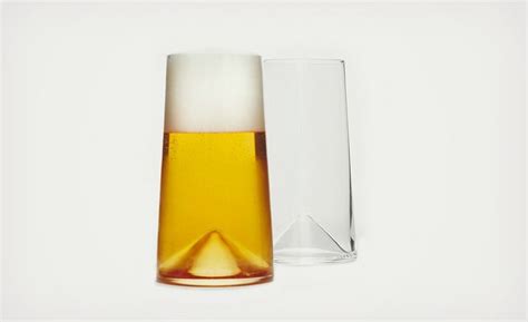 Two Glasses Sitting Next To Each Other On A Table