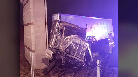 Semi Driver Recovering After Crashing Into Highway Overpass Pillar In