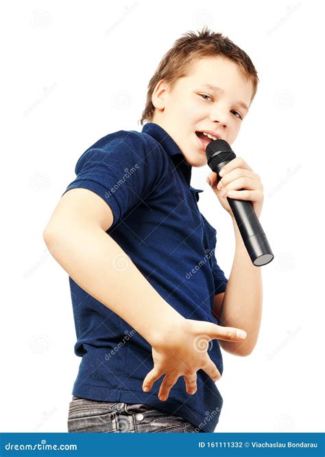 Teenage Boy Singing Into A Microphone And Gesticulates With A Hand