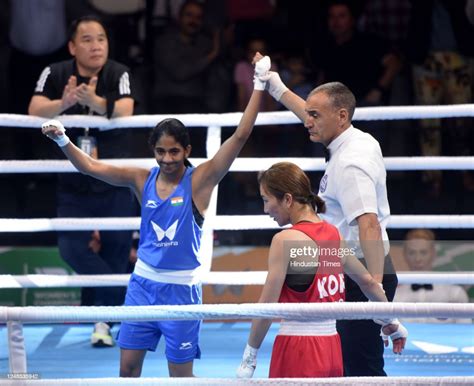 Indian Women Boxer Nitu And Korea Boxer Doyeon Kang In Action During