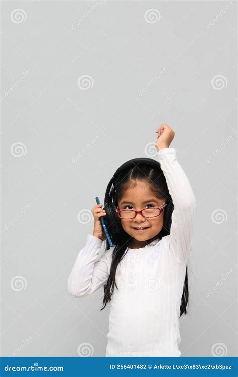Year Old Brunette Latin Girl With Glasses Listens To Music In Her