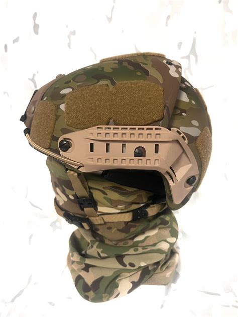 the helmet is made out of camouflage fabric