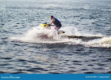 Man Speeding On Jet Ski On Lake During Summer Vacation Stock Image Image Of Powerboat Resort