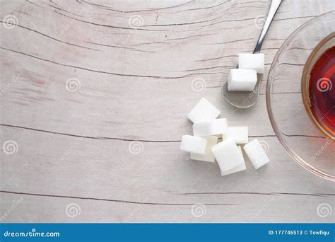 Top View Of Sugar Cube On Spoon On Wooden Background Stock Image