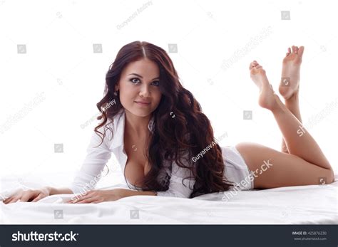 Sexy Brunette Looking Camera While Lying Stock Photo 425876230 Shutterstock