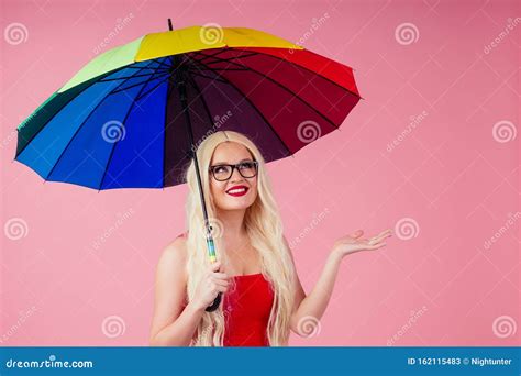 Beautiful Smiling Young Woman With Long Blond Wig Holding Colorful