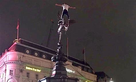 Man Brings Chaos To London By Climbing Up Eros Statue In Piccadilly