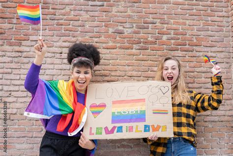 LGBT Pride Concept Gay Lifestyle A True Lesbian Couple Hugging And Kissing With The Iconic