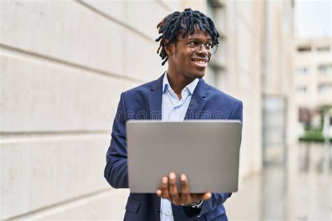 African American Man Executive Smiling Confident Using Laptop At Street