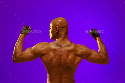 Back View Of Naked Torso Of Muscular Man On Studio Background Strength And Motivation Stock