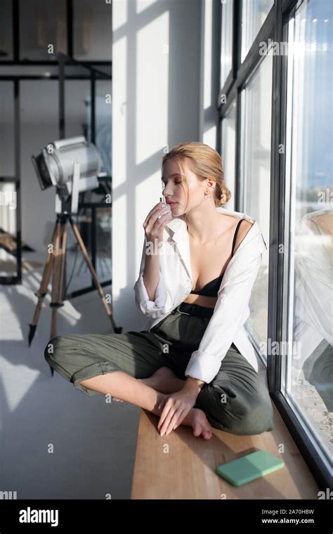 Blonde Woman Smelling Her Favorite Perfume In The Morning Stock Photo Alamy