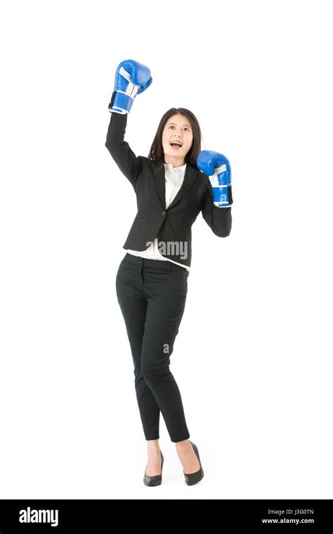 Business woman in boxing gloves standing in victory pose isolated on ...