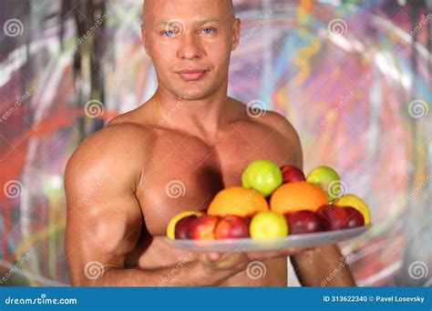 Muscular Bald Man With A Naked Torso With A Plate Stock Photo Image