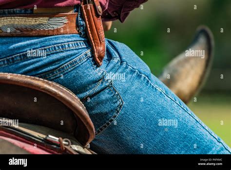 Horse Rider With Knife And Blue Jeans Scenes From A Rodeo And