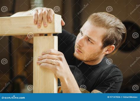 Man Joining Two Parts Of Wooden Planks Worker Carpenter Joiner Stock