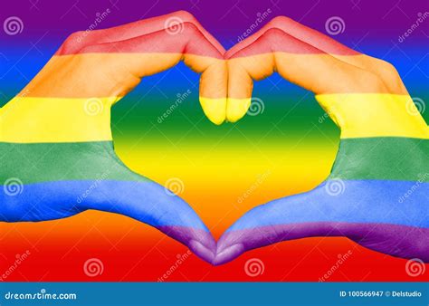 Gay Rainbow Flag Painted On Hands Forming A Heart On Rainbow Background Gay Love Concept Stock