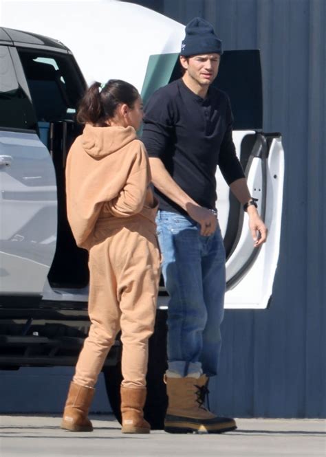 MILA KUNIS and Ashton Kutcher Returning from a Ski Trip in Los Angeles