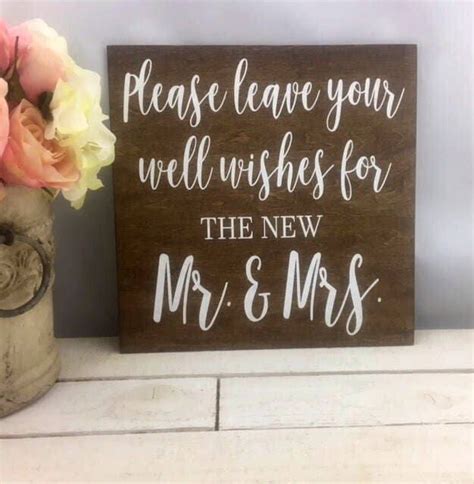 A Wooden Sign That Says Please Leave Your Well Wishes For The New Mr And Mrs