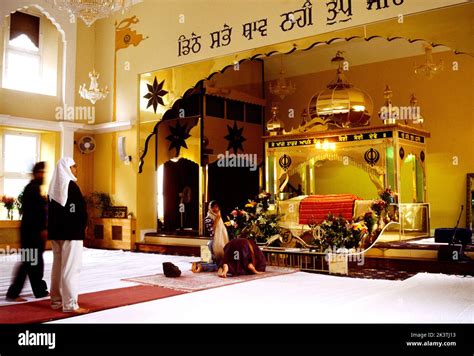 Worshippers Bowing Before The Guru Granth Sahib Under The Palki Sahib