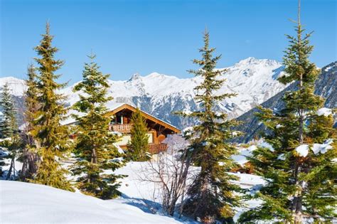 Premium Photo Wooden House In The Alps Mountains Winter Landscape