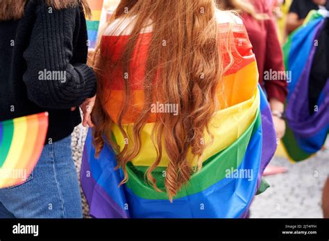 Lgbt Woman Wrapped In Colorful Rainbow Flag During Gay Pride Stock