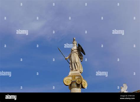 The Statue Of Athena Goddess Of Wisdom On A Column Outside The