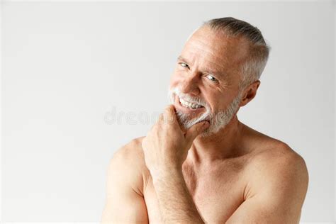 Portrait Of Mature Handsome Bearded Man Posing Shirtless Smiling