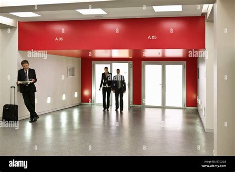 Business people in a lobby Stock Photo - Alamy