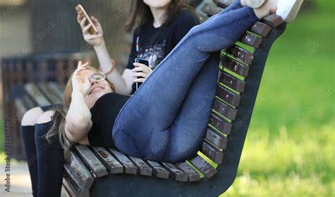 Sexy Legs And Ass Girls In Jeans On A Bench Stock Photo Adobe Stock
