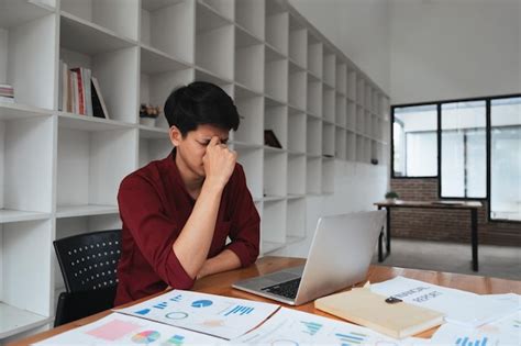 Premium Photo Stress Anxiety And Burnout With Work A Business Man At Work Using A Laptop While