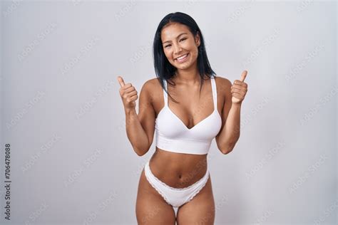Hispanic Woman Wearing Lingerie Success Sign Doing Positive Gesture