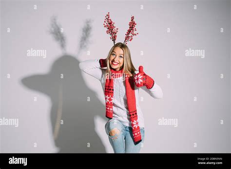 Happy Blonde Girl Making Reindeer Horns Stock Photo Alamy