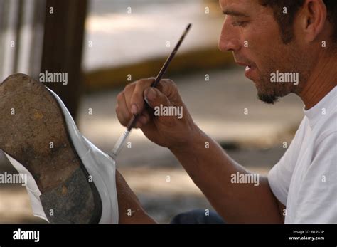 shoe-shine man painting Stock Photo - Alamy