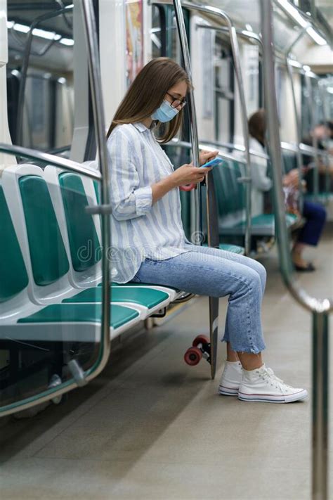 Millennial Woman Passenger Using Mobile Phone Wear Face Mask Against