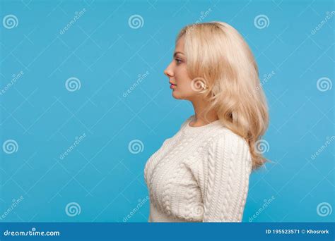 Profile Portrait Serious Assertive Blond Lady In Knitted Sweater