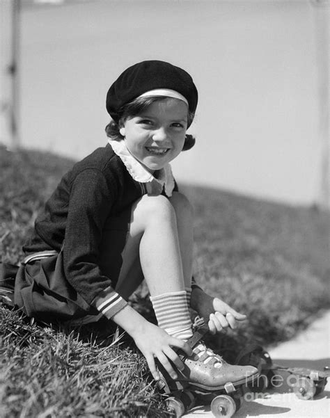 Girl Putting On Roller Skates C 1930s Photograph By H Armstrong Roberts Classicstock Fine