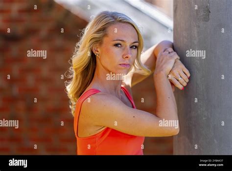 Radiant Blonde Athlete Shines At The Track On A Stunning Day Embodying Strength And Grace In