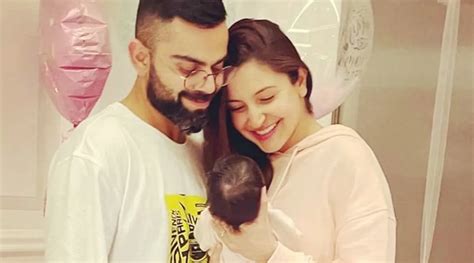 Anushka Sharma holds daughter Vamika as Virat Kohli carries luggage in ...