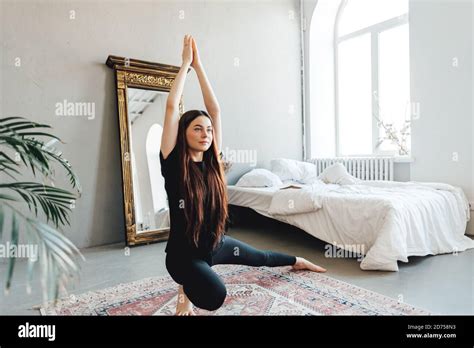 Beautiful Brunette Fitness Woman Make Stretching Exercises Doing Yoga At Home Stock Photo Alamy
