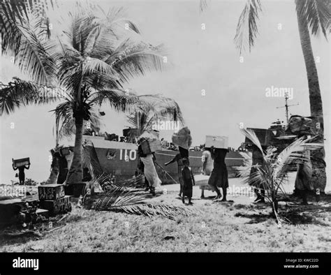 People Of Bikini Atoll Carry Their Belongings Down To Boat 40 Families Were Temporarily Moved