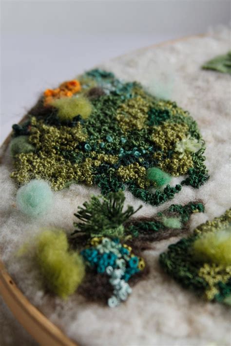 A Close Up View Of Some Green And Yellow Decorations On A White Table