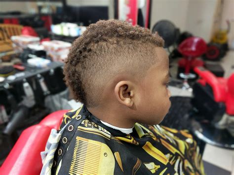 Barbers are debating the best way to cut a black faded mohawk 20