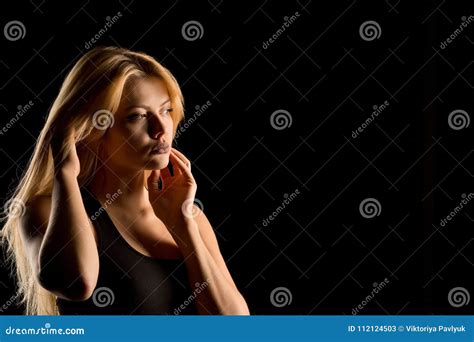 Charming Blonde Girl Wearing Black Sport Lingerie Posing In The Stock