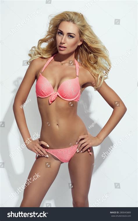 Sexy Blonde Woman Wearing Pink Swimwear Stock Photo
