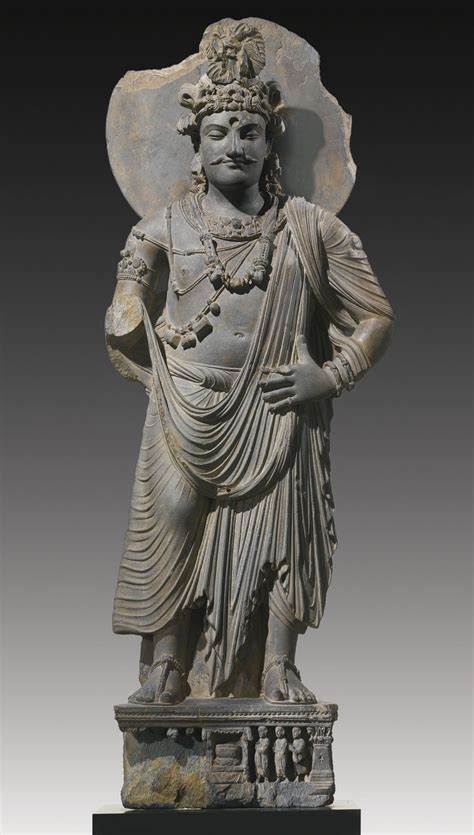 A GREY SCHIST STANDING BODHISATTVA Height: 57 3/4 in. (148 cm) Ancient ...