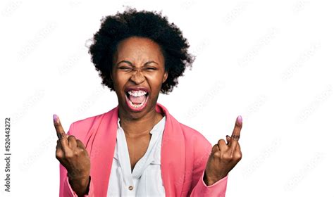 African American Woman With Afro Hair Wearing Business Jacket Showing Middle Finger Doing Fuck